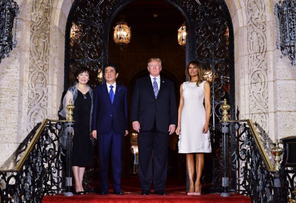 Trump Melania greet Japan's Prime Minister Shinzo Abe and his wife Akie Abe.
