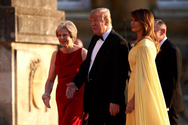 Trump and Melania welcome by British prime minister Theresa May.