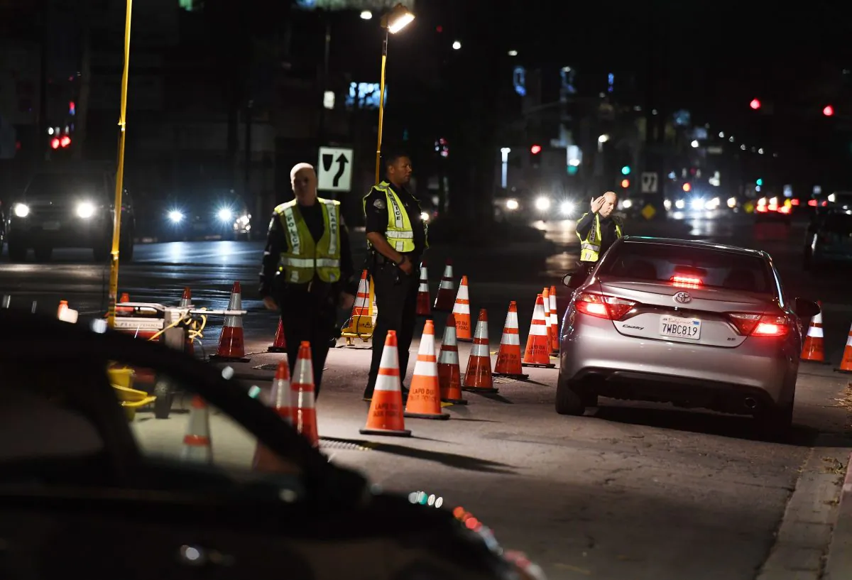 LAPD officers check drivers at a DUI checkpoint in Reseda, Los Angeles, Calif., on April 13, 2018. (Mark Ralston/AFP/Getty Images)