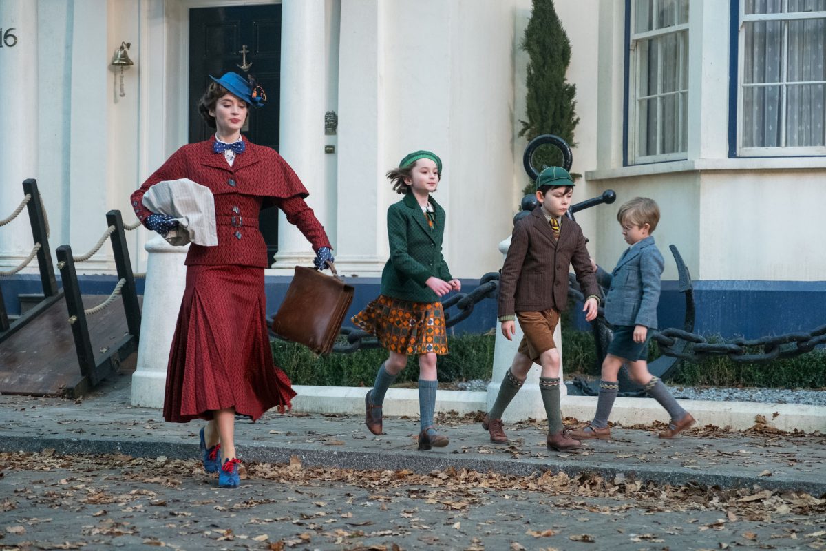 Mary Poppins and Banks children walk down the street
