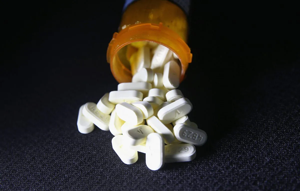Oxycodone pain pills prescribed for a patient with chronic pain lie on display in Norwich, Conn., on March 23, 2016. (John Moore/Getty Images)