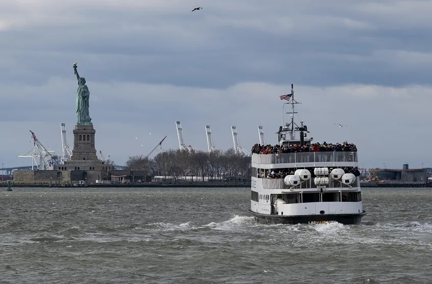 A ferry full of passengers steams towards the Statue of Liberty on Dec. 22, 2018, in New York (AP Photo/Craig Ruttle)