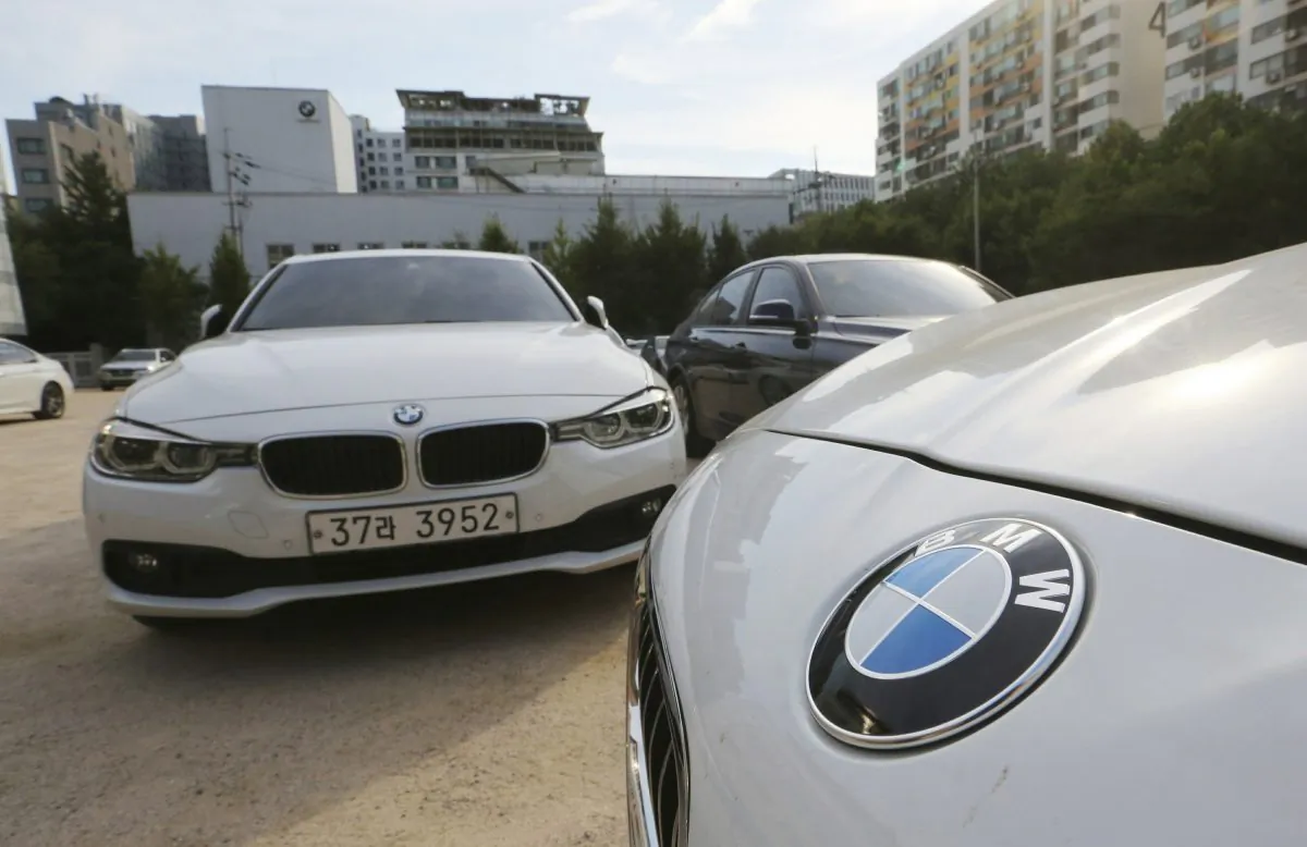 BMW cars are parked for an emergency safety check at the playground of an elementary school near a BMW service center in Seoul, South Korea, on Dec. 24, 2018. (Ahn Young-Joon/AP)