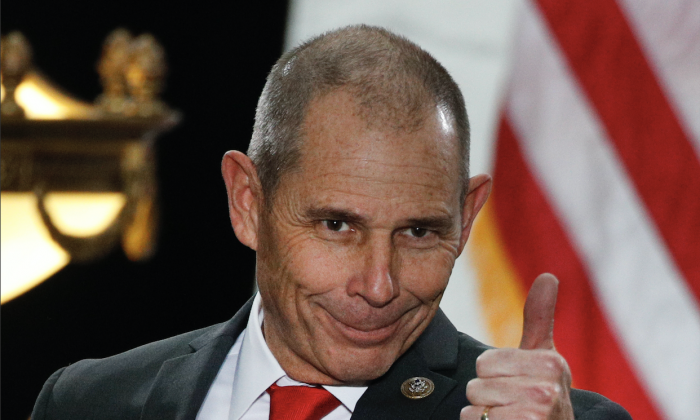 Rep. John Curtis (R-Utah) gives a thumbs up before a event with then-President Donald Trump at the Rotunda of the Utah State Capitol on Dec. 4, 2017, in Salt Lake City. (George Frey/Getty Images)