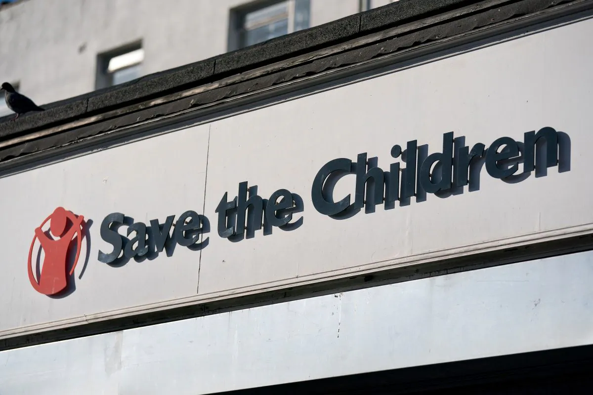 A Save The Children sign is pictured outside a high street branch one of its stores in London on Feb. 17, 2018. (Justin Tallis/AFP/Getty Images)