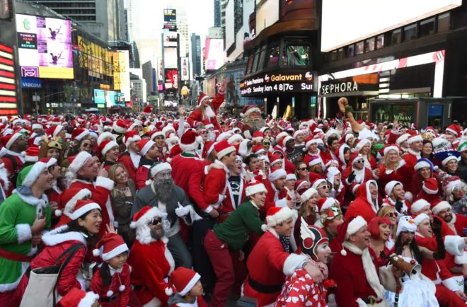People dressed as Santa Claus and Mrs. Claus celebrate in New York at Santacon festivities on December 13, 2014, in New York. (Don Emmert/Getty Images)