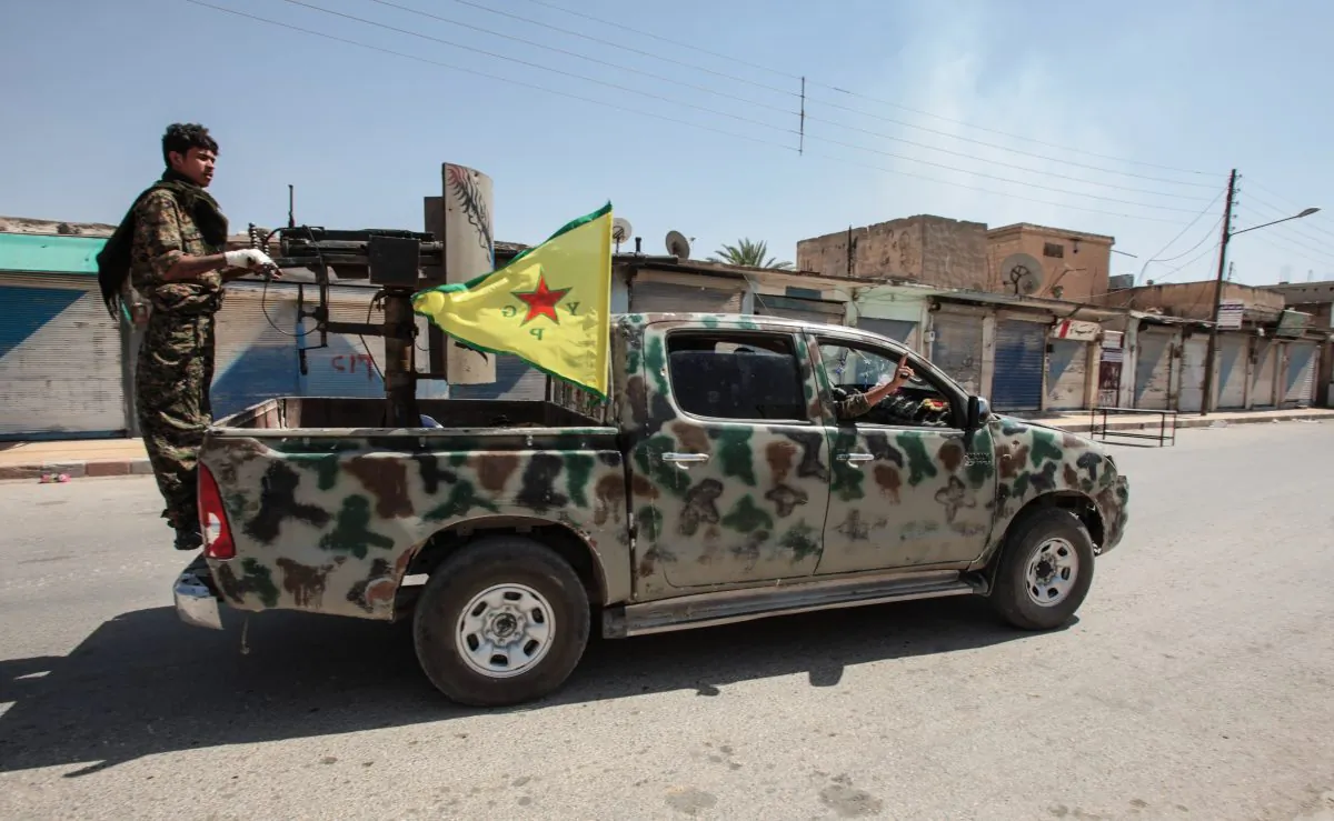 Kurdish People's Protection Units, or YPG fighters control downtown of Tal Abyad, Syria, on June 19, 2015. (Ahmet Sik/Getty Images)