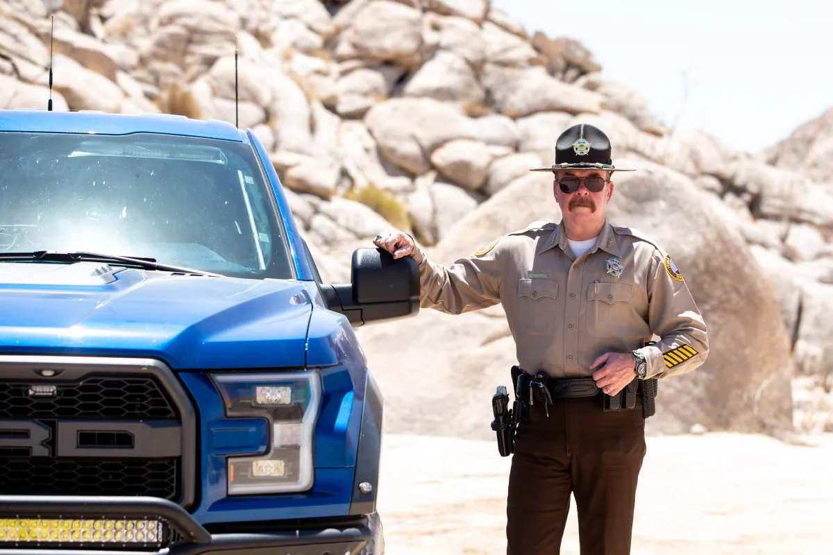 Sheriff Leon Wilmot in the desert by the U.S.–Mexico border near Yuma, Ariz., on May 25, 2018. (Samira Bouaou/The Epoch Times)