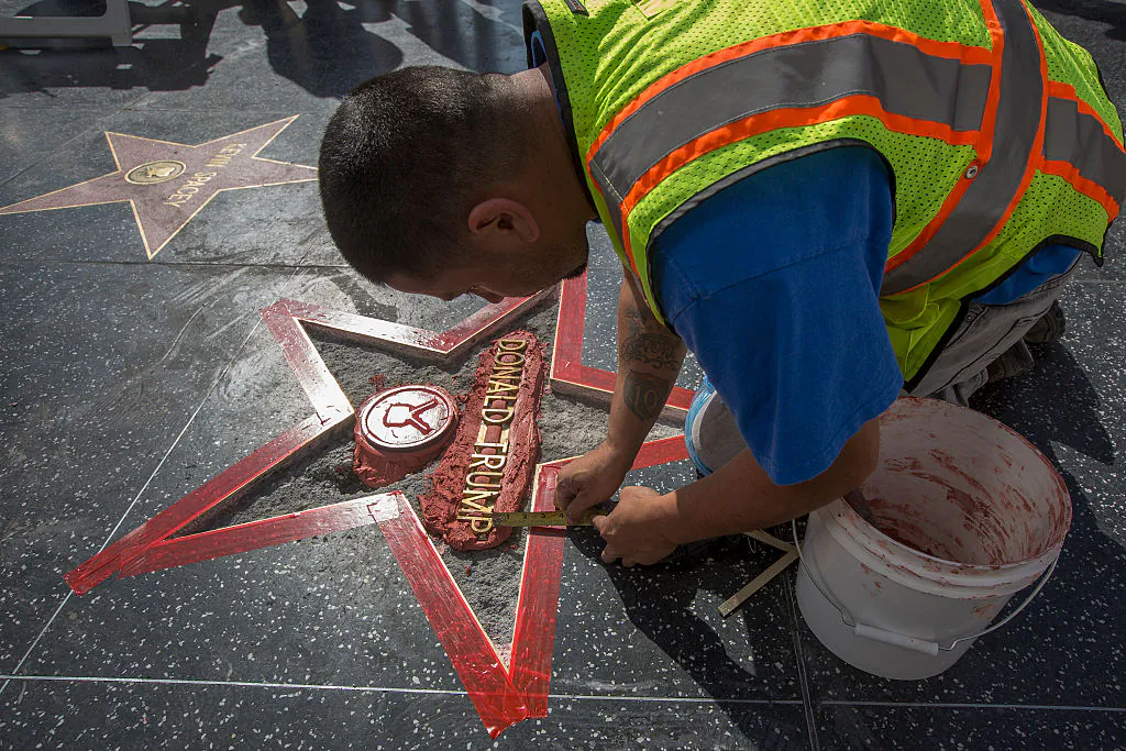 Workers repair the Hollywood Walk of Fame star of Republican presidential candidate Donald Trump after it was vandalized by a protester in Hollywood, California, on Oct. 26, 2016. (David McNew/Getty Images)