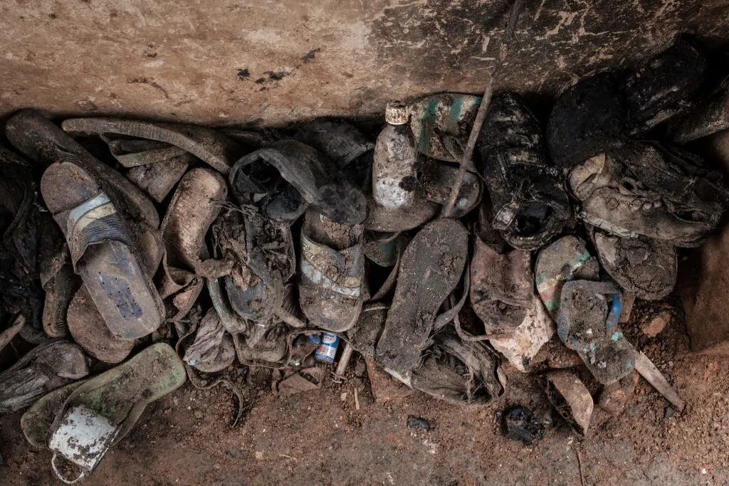 Victims' items collected from a pit which was used as mass grave during 1994 Rwandan genocide and hidden under a house in Kabuga, on the outskirts of Kigali, Rwanda. The photo taken on April 30, 2018. (Yasuyoshi Chiba/AFP/Getty Images)