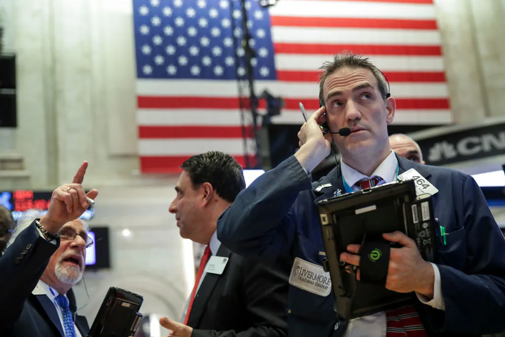 Traders and financial professionals work ahead of the closing bell on the floor of the New York Stock Exchange in New York on Dec. 20, 2018. (Drew Angerer/Getty Images)