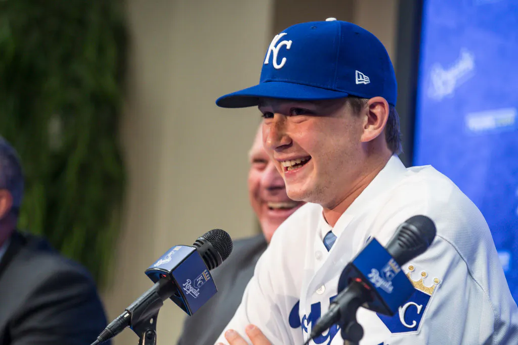 The 2018 Kansas City Royals first-round pick pitcher Brady Singer smiles during a press conference before the game between the Cleveland Indians and the Kansas City Royals at Kauffman Stadium in Kansas City, Missouri on July 3, 2018. (Photo by Brian Davidson/Getty Images)