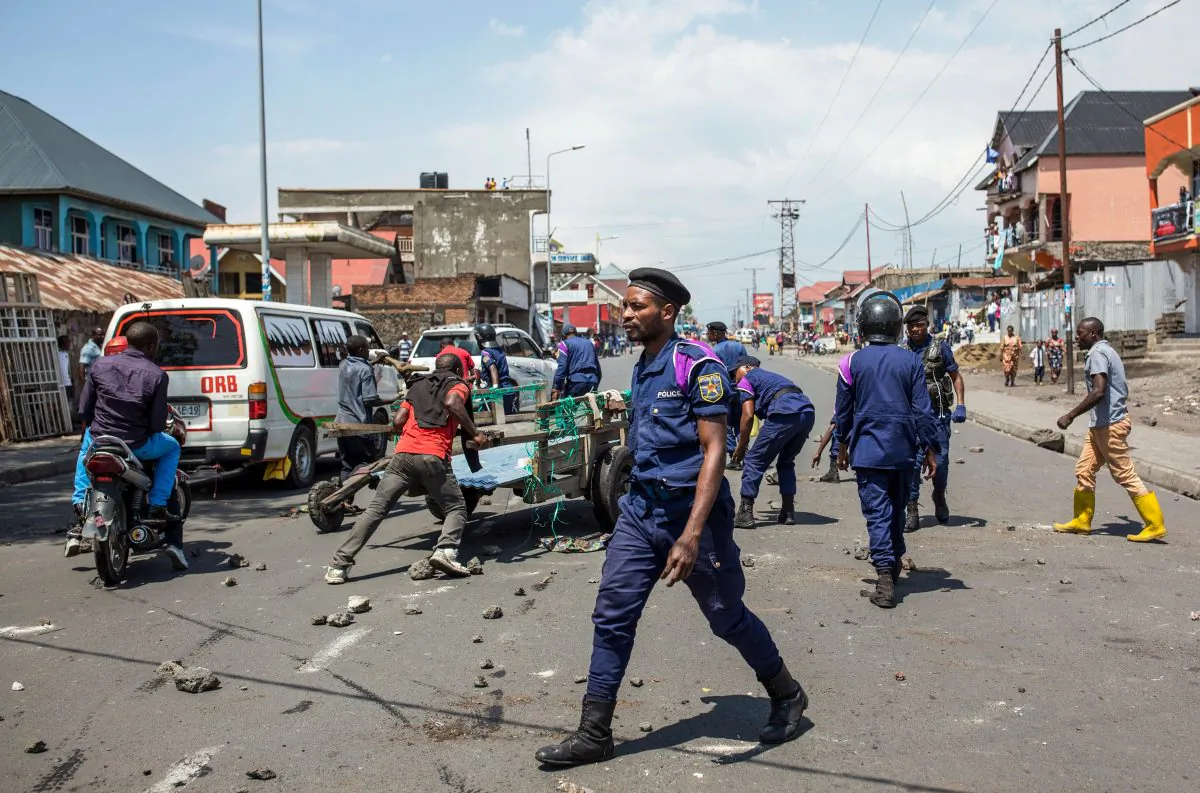 Congolese National Police clear a road in Goma on Dec. 27, 2018, following a demonstration against the postponement of the general elections in this area because of the Ebola outbreak, announced the day before by the Congolese national committee. (Patrick Meinhardt/AFP/Getty Images)