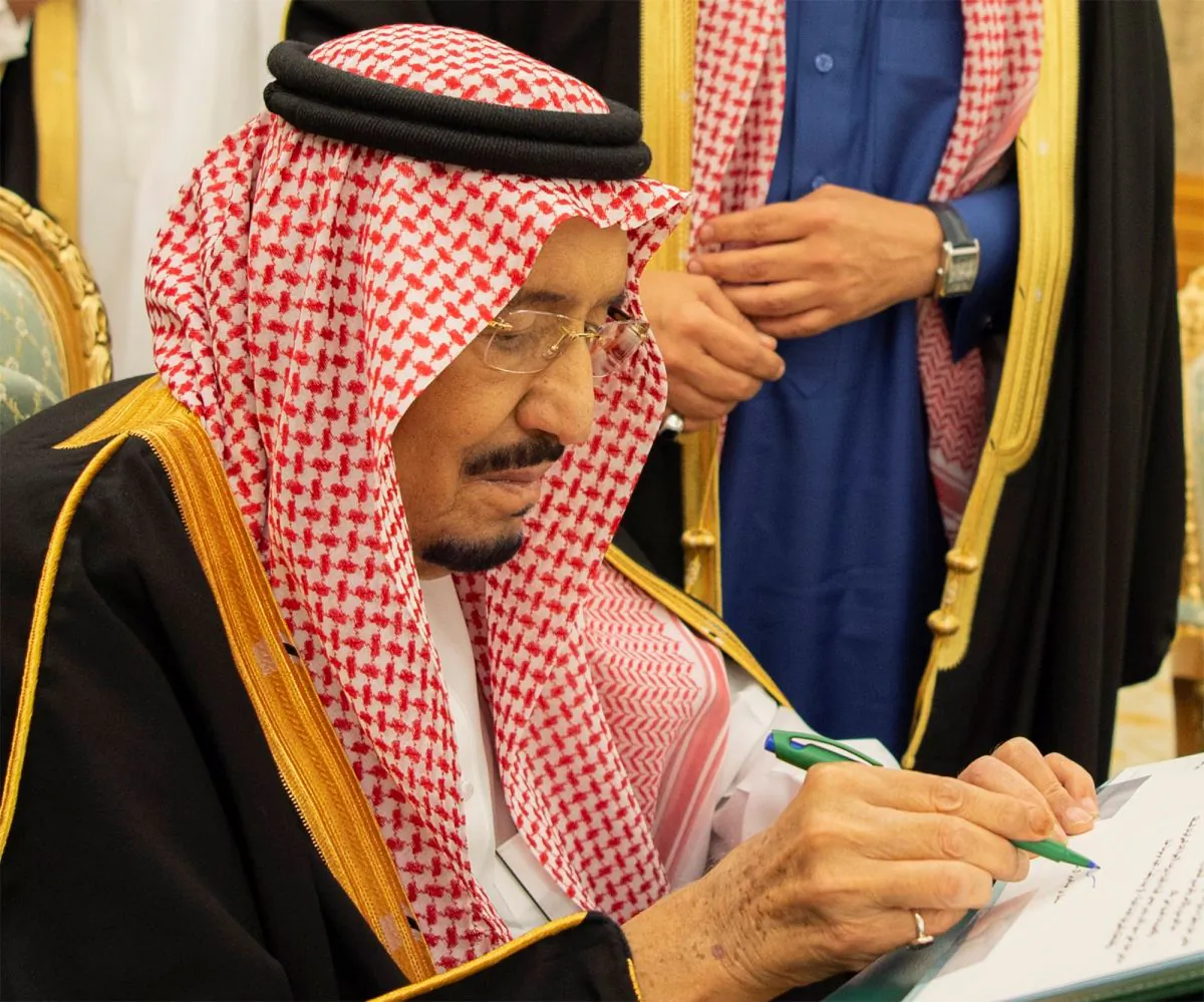 Saudi Arabia's King Salman bin Abdulaziz Al Saud signs documents during the 2019 budget meeting in Riyadh, Saudi Arabia, on Dec. 18, 2018. (Bandar Algaloud/Courtesy of Saudi Royal Court/Handout via Reuters)
