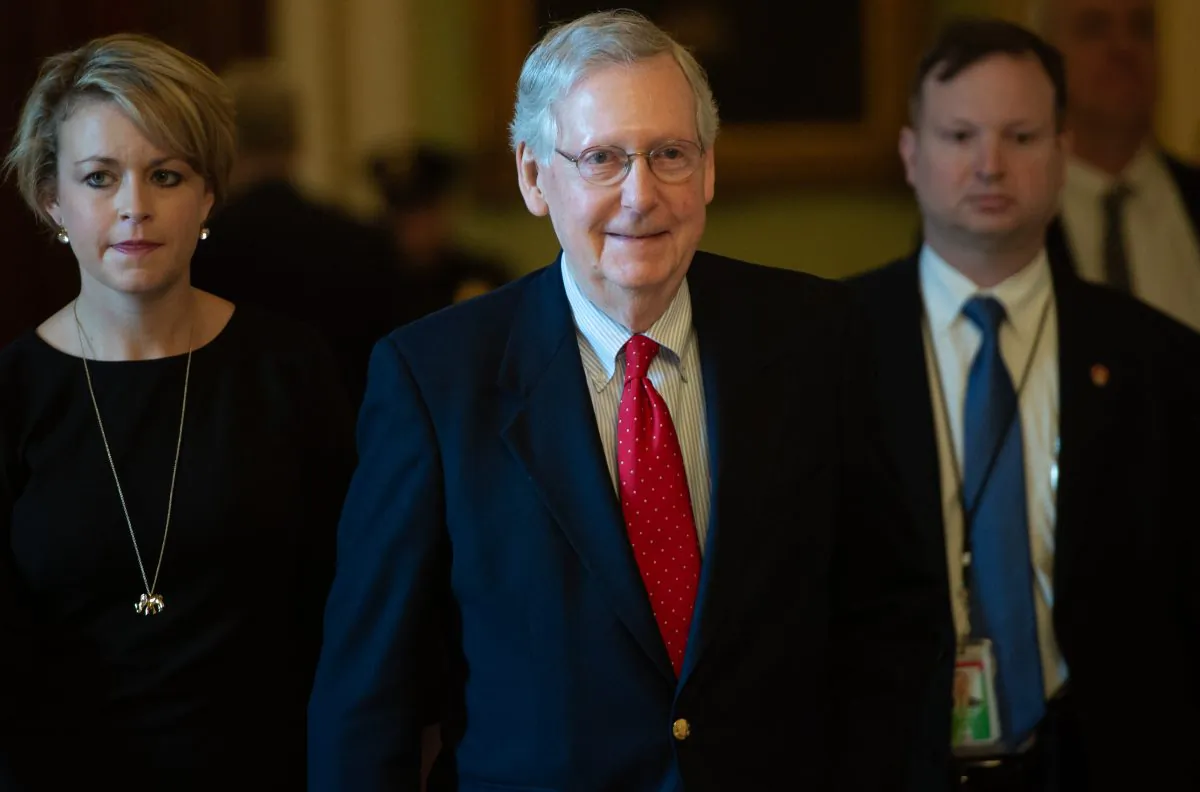 Senate Majority Leader Mitch McConnell (C) walks to his office at the U.S. Capitol on Dec. 21, 2018. (Saul Loeb/AFP/Getty Images)