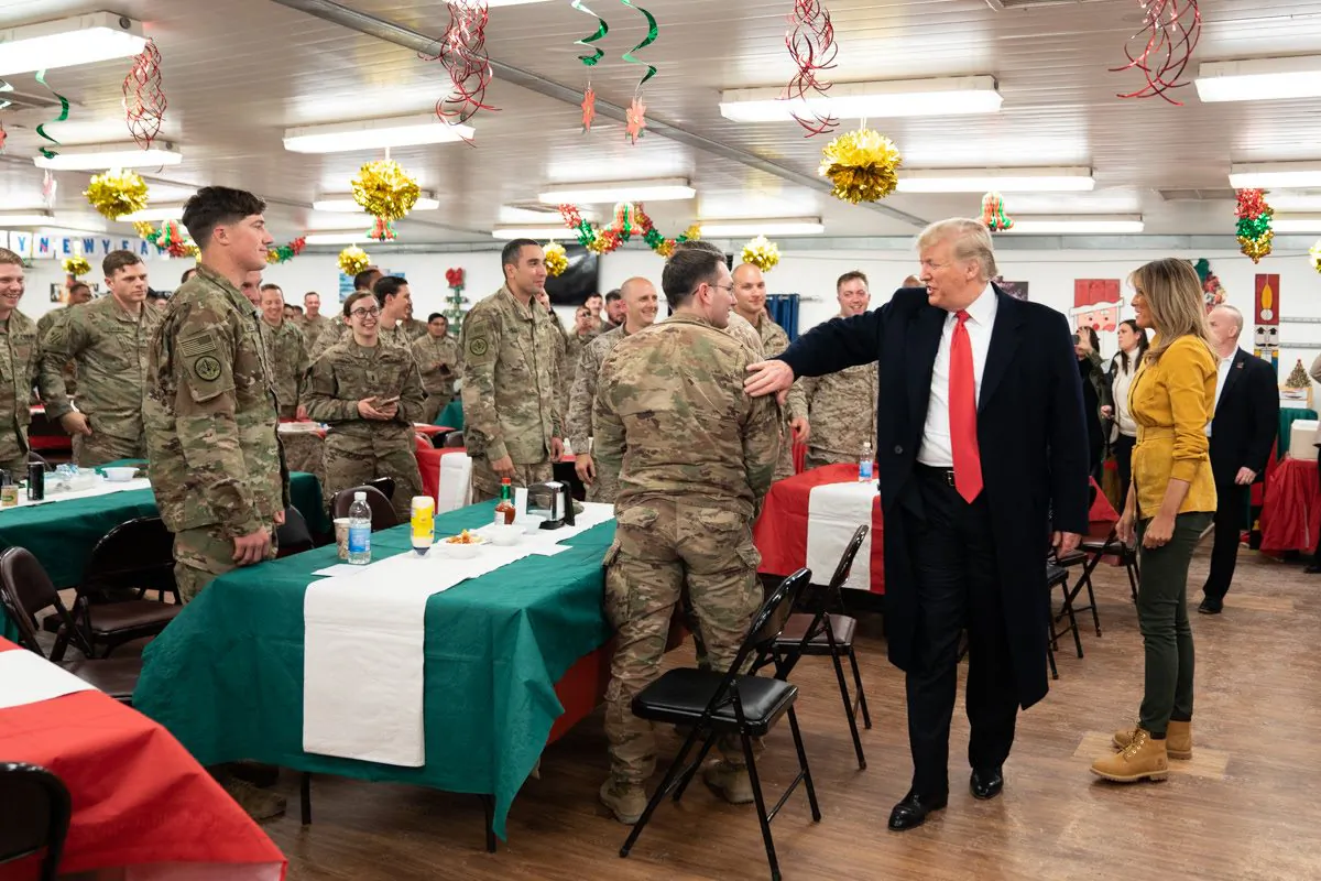 President Donald J. Trump, joined by First Lady Melania Trump, visits U.S. troops at their dining hall Wednesday, December 26, 2018, at the Al-Asad Airbase in Iraq. (Official White House Photo by Shealah Craighead)