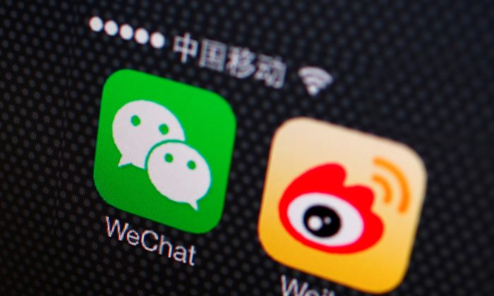 Icons of the WeChat and Weibo apps are seen on a smartphone on Dec. 5, 2013. (Petar Kujundzic/Reuters)