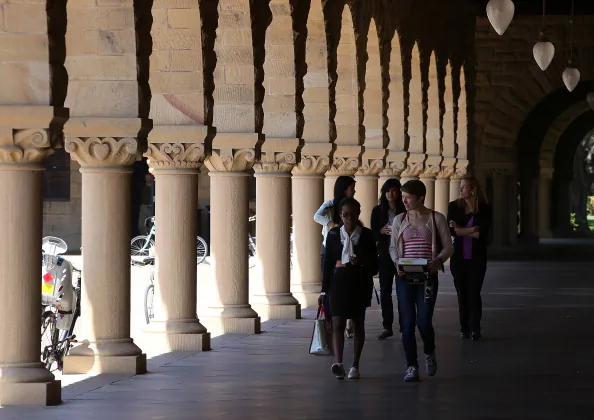 People walk through the Stanford University campus on May 22, 2014. (Justin Sullivan/Getty Images)