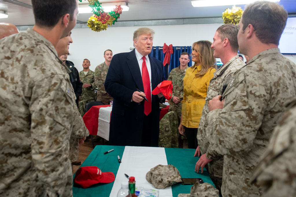 trump signing troops hat