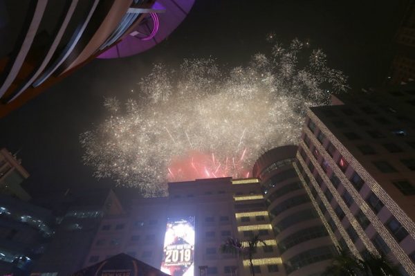 Fireworks light up the sky at the Eastwood Shopping Mall as Filipinos welcome the New Year Tuesday, Jan. 1, 2019 in suburban Quezon city northeast of Manila, Philippines. Filipinos welcome the New Year with the loudest noise possible including setting off powerful firecrackers in one of Asia's most violent celebrations despite a government scare campaign and threats of arrests.