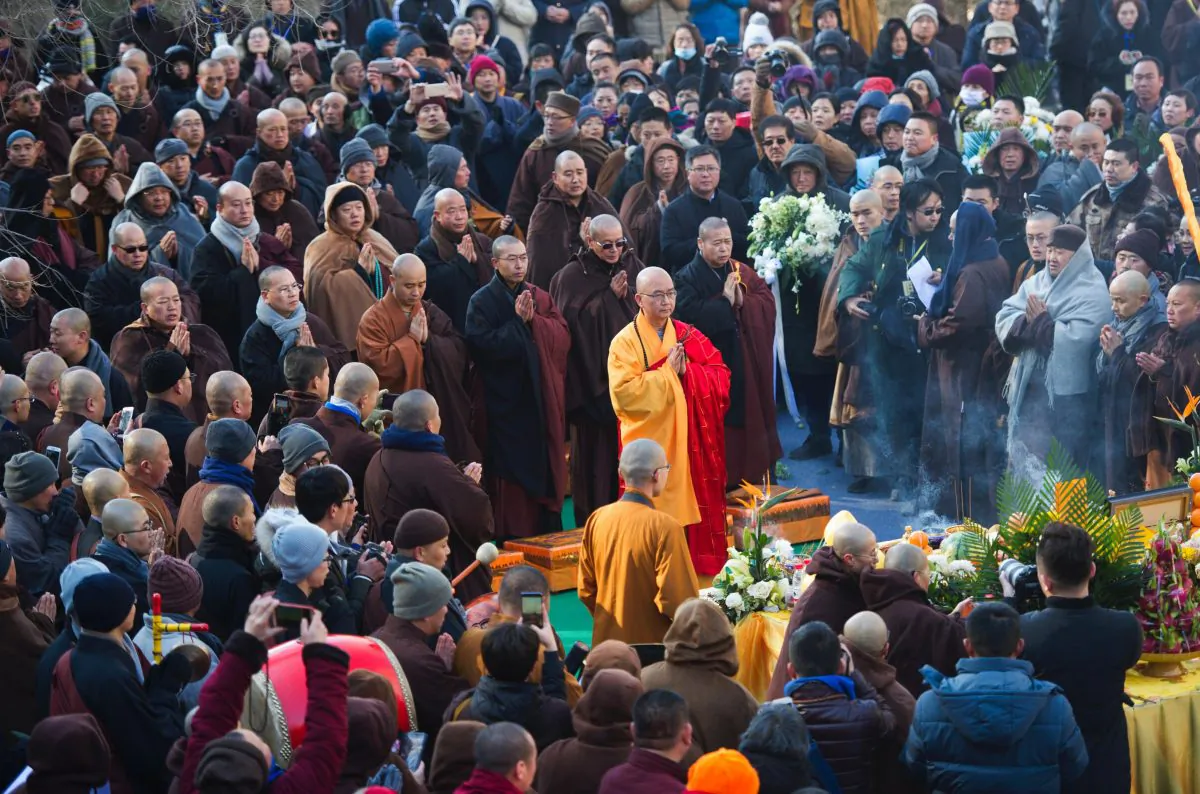 Xuecheng (c), the abbot of Beijing's Longquan Monastery, prays during a memorial event in China's Shanxi Province on Dec. 3, 2017. He was the former head of China's government-run Buddhist association and a Communist Party member. He was under criminal investigation for alleged sexual assault in 2018. ( STR/AFP/Getty Images)