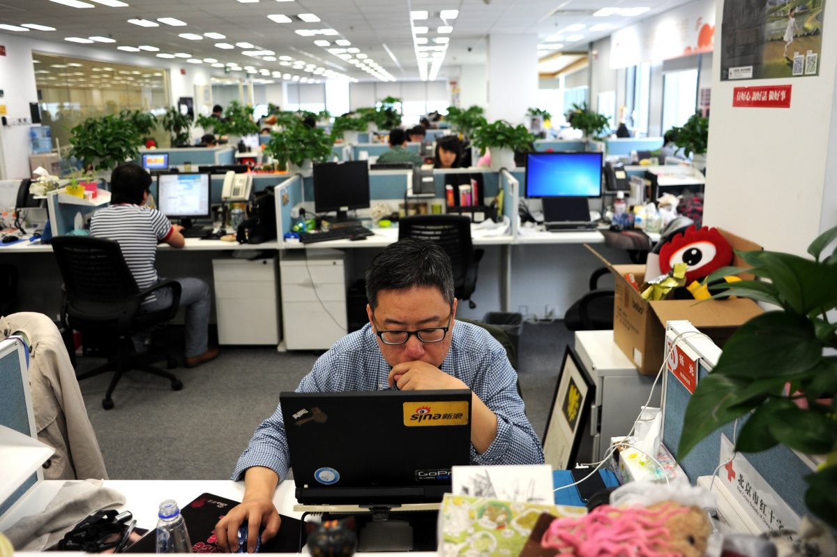 A man uses a laptop in the Beijing office of Sina Weibo, widely known as China's version of Twitter.