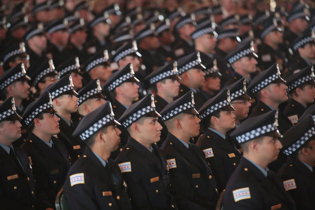Chicago police officers attend a graduation and promotion ceremony in the Grand Ballroom on Navy Pier in Chicago, Ill., on June 15, 2017. (Scott Olson/Getty Images)