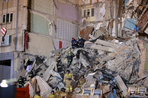 Emergency officers inspect rubble as they take part in a rescue operation after a gas explosion rocked a residential building in Russia's Urals city of Magnitogorsk