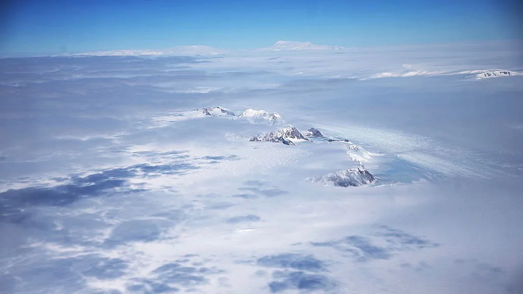 A section of the West Antarctic Ice Sheet with mountains is viewed from a window of a NASA Operation IceBridge airplane in-flight over Antarctica on Oct. 31, 2016.  (Mario Tama/Getty Images)