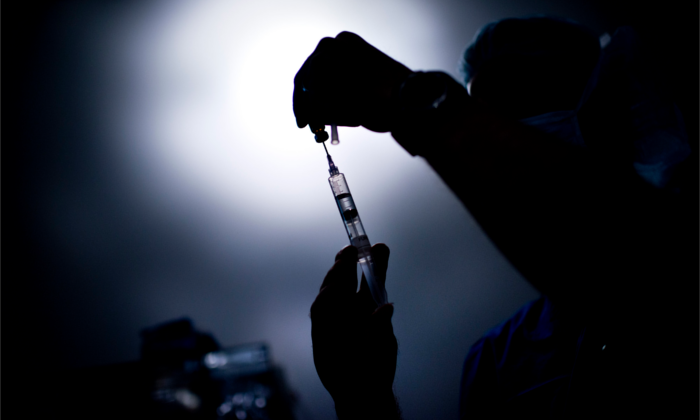 A doctor draws medicine into a syringe on June 26, 2012. (Brendan Smialowski/AFP/GettyImages)