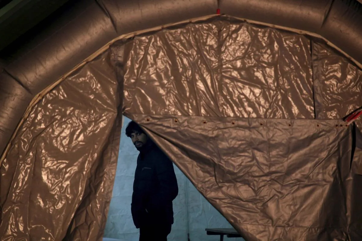 One of a group of 69 migrants rescued south-west of Malta waits to be processed in Valletta's Marsamxett Harbour, Malta, on Dec. 30, 2018. (Reuters/Darrin Zammit Lupi/File Photo)