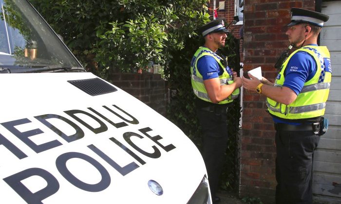 Wales Police outside a property in Cardiff on June 19, 2017. (Geoff Caddick/AFP/Getty Images)