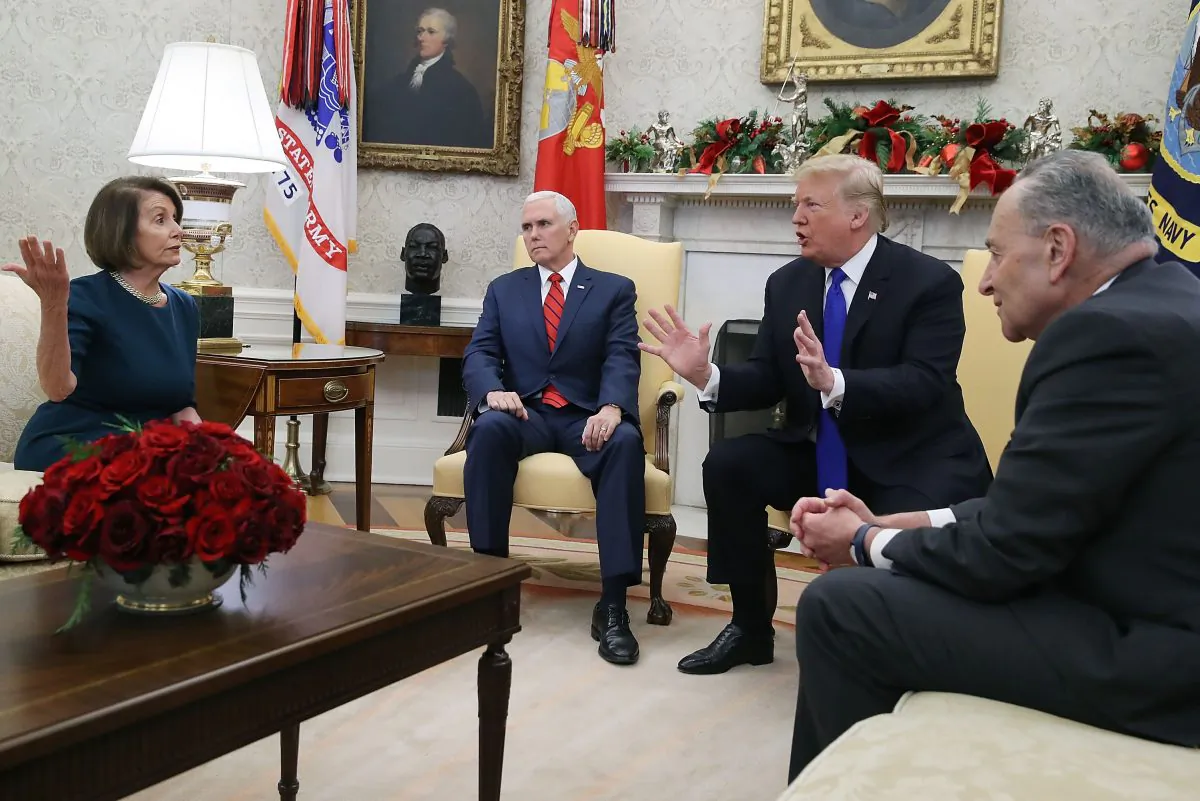 President Donald Trump (2R) argues about border security with Senate Minority Leader Chuck Schumer (R) and House Minority Leader Nancy Pelosi as Vice President Mike Pence sits nearby in the Oval Office on Dec. 11, 2018. (Mark Wilson/Getty Images)