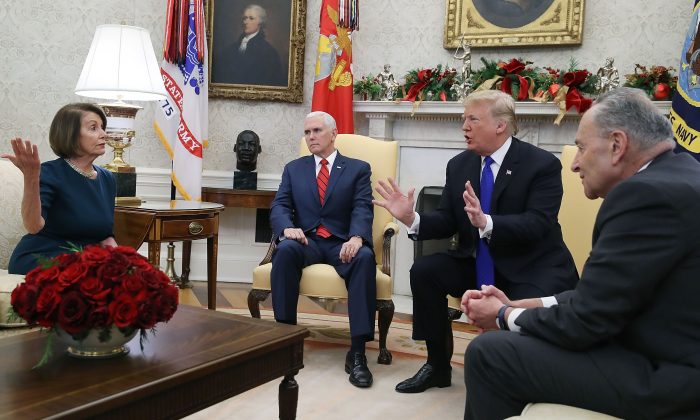 President Donald Trump (2R) argues about border security with Senate Minority Leader Chuck Schumer (R) and House Minority Leader Nancy Pelosi as Vice President Mike Pence sits nearby in the Oval Office on Dec. 11, 2018. (Mark Wilson/Getty Images)