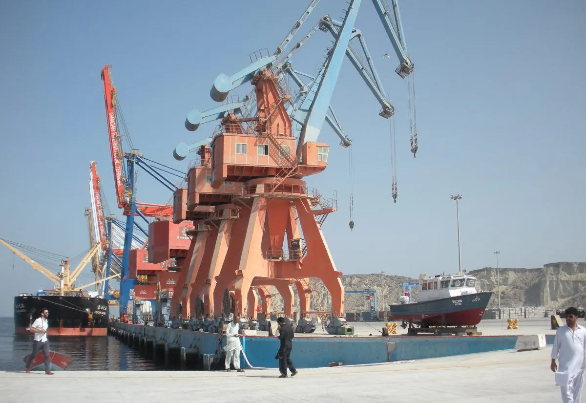 Laborers walk through the Gwadar Port in Pakistan, a multi-billion dollar infrastructure project that China has invested in as part of its Belt and Road Initiative,  on Oct. 4, 2017. (Amelie Herenstein/AFP/Getty Images)