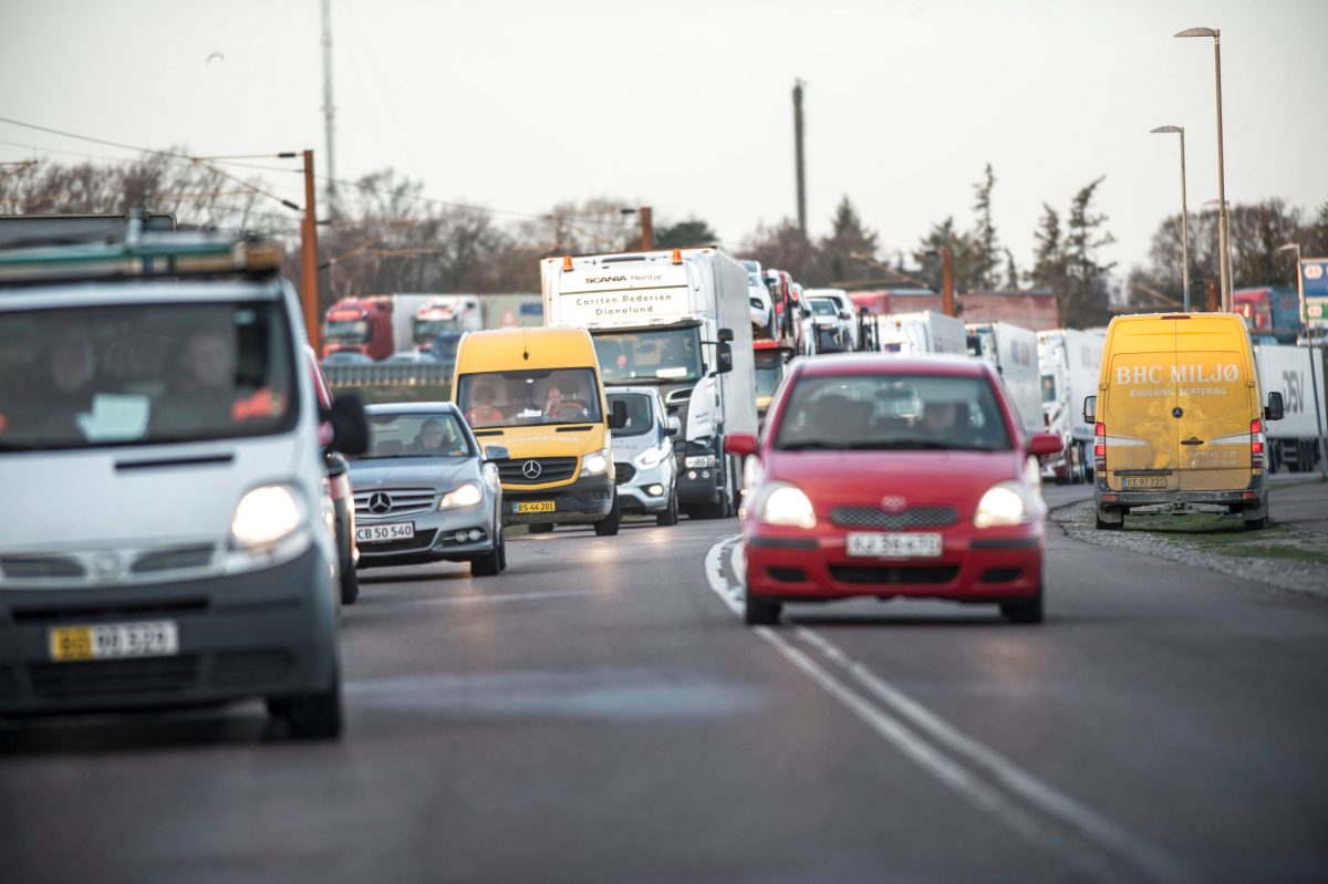 cars wait on bridge closed due to crash