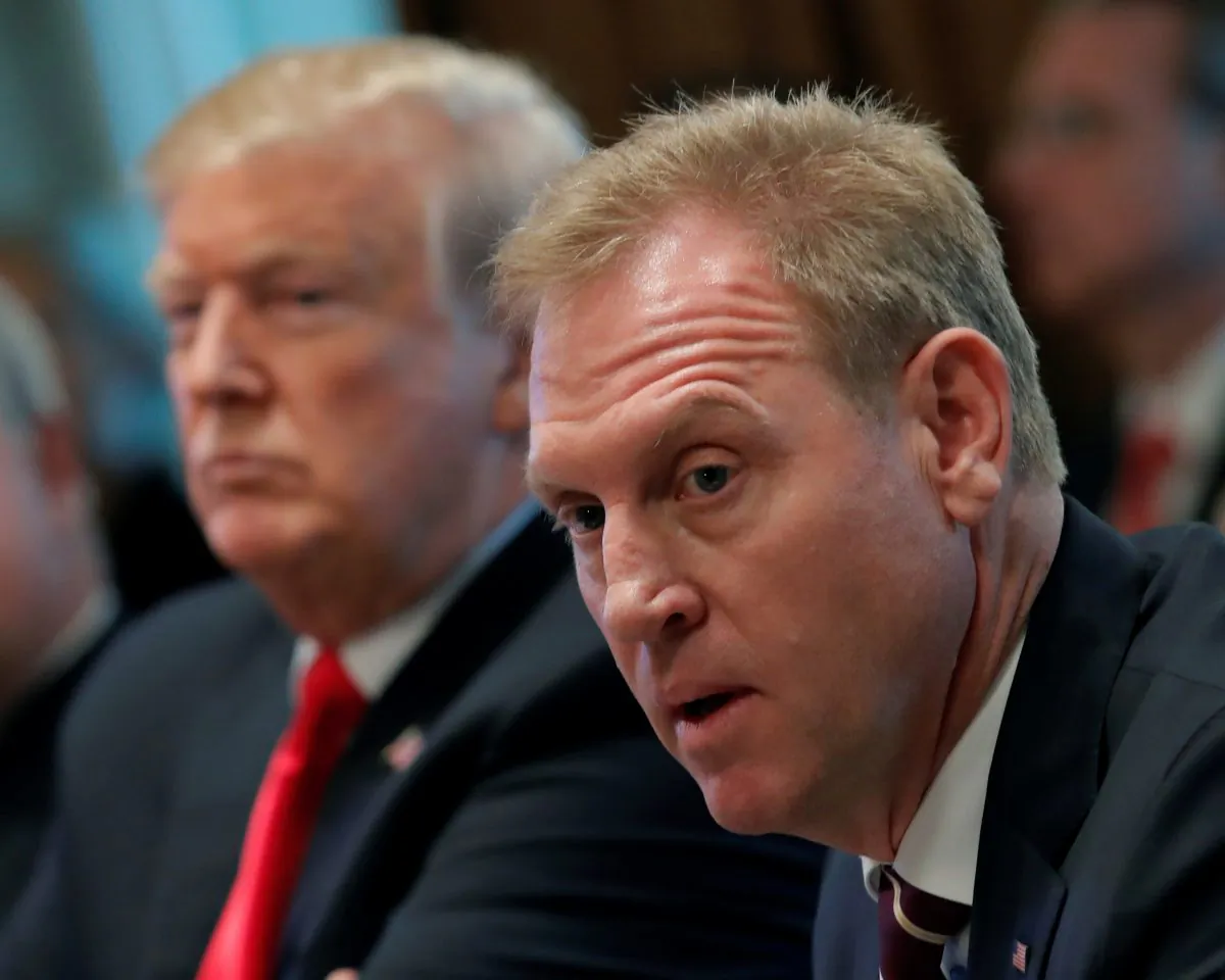 U.S. President Donald Trump (L) listens next to Acting U.S. Defense Secretary Patrick Shanahan during a Cabinet meeting on day 12 of the partial U.S. government shutdown at the White House in Washington, U.S., on Jan. 2, 2019. (Jim Young/Reuters)