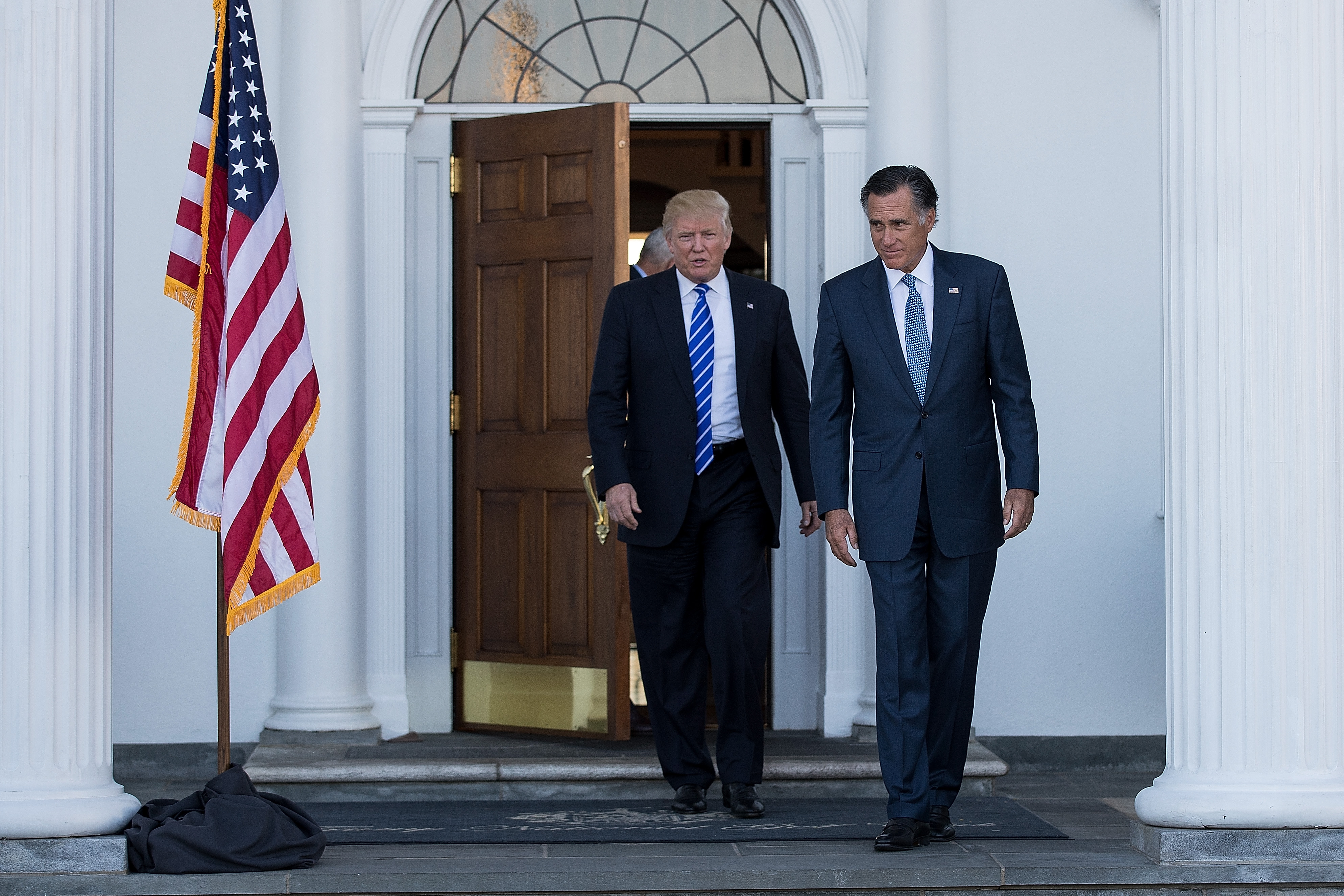 President-elect Donald Trump and Mitt Romney leave the clubhouse after their meeting at Trump International Golf Club in Bedminster Township