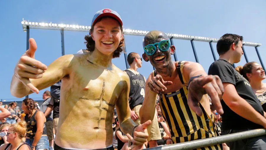 Freshmen Josh Seals, left, and Tyler Trent, wearing glasses at right, get set for Purdue's NCAA college football game against Michigan at Ross-Ade Stadium, in West Lafayette, Ind., on Sept. 23, 2017. (John Terhune/Journal & Courier via AP)