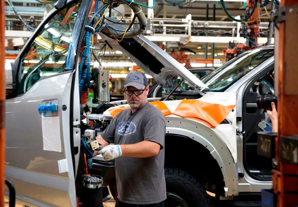 An employee works on the assembly line for the Ford 2018 and 2019 F-150 truck at the Ford Motor Company's Rouge Complex in Dearborn, Michigan, on Sept. 27, 2018 . (JEFF KOWALSKY/AFP/Getty Images)