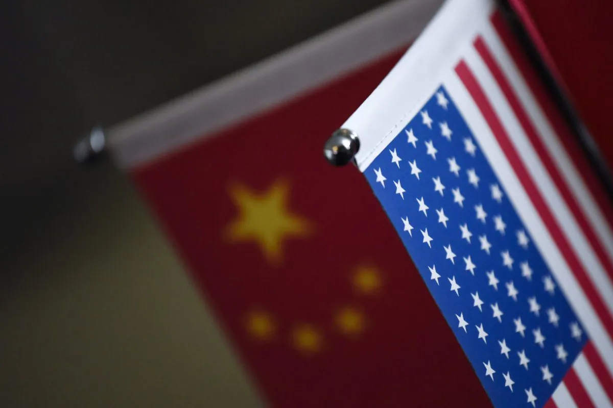 Chinese flags and American flags are displayed in a company in Beijing, China, on Aug. 16, 2017. (Wang Zhao/AFP/Getty Images)