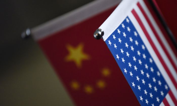 Chinese flags and American flags are displayed in a company in Beijing, China, on Aug. 16, 2017. (Wang Zhao/AFP/Getty Images)