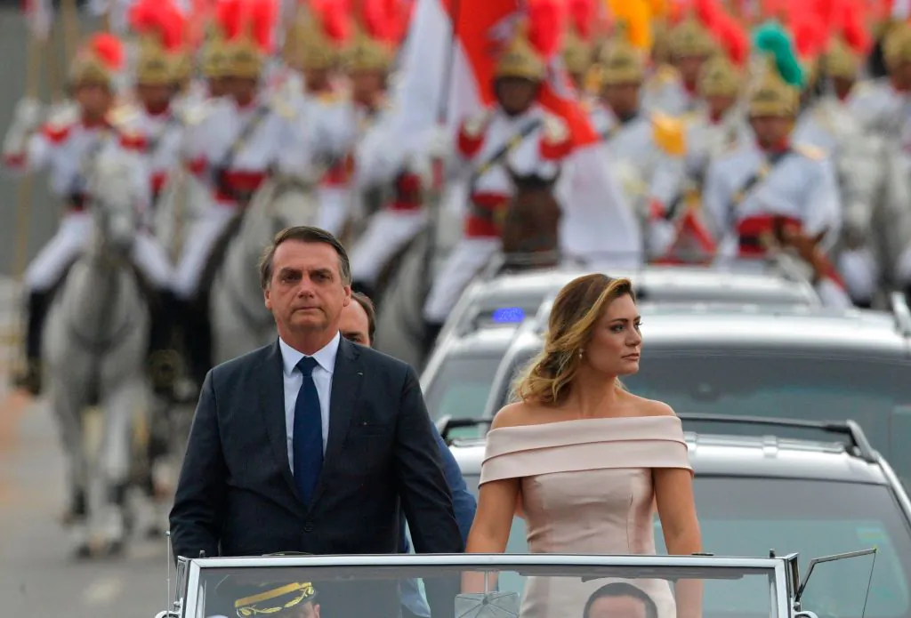 The presidential convoy, led by Brazil's President-elect Jair Bolsonaro (L) and his wife Michelle Bolsonaro in a Rolls Royce, heads to the National Congress for his swearing-in ceremony, in Brasilia on Jan.1, 2019. (Carl De Souza/AFP/Getty Images)
