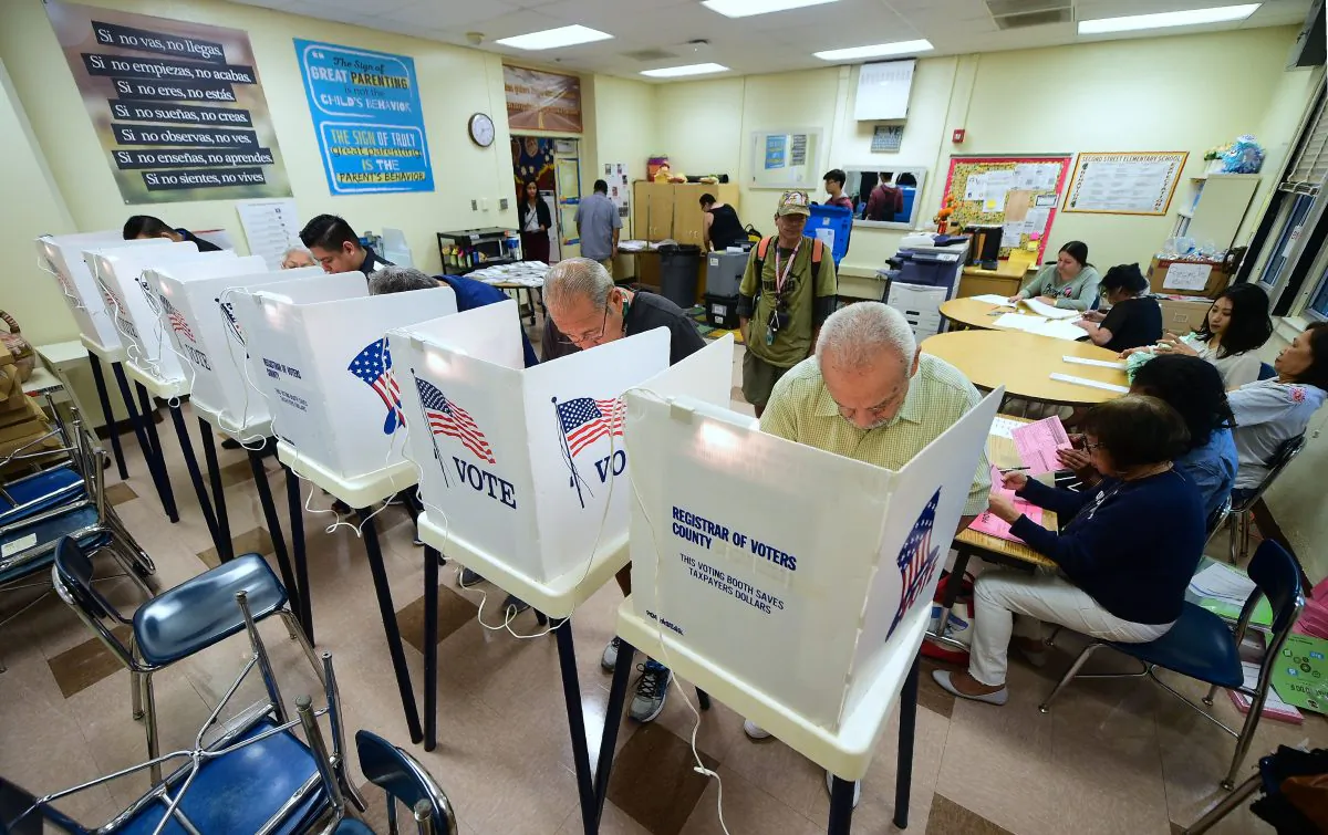 People cast their ballots in voting booths at the Second Street Elementary School in the Boyle Heights neighborhood of Los Angeles, California on Nov. 6, 2018, as Americans across the country cast their votes for the midterm elections. (Frederic Brown/AFP/Getty Images)