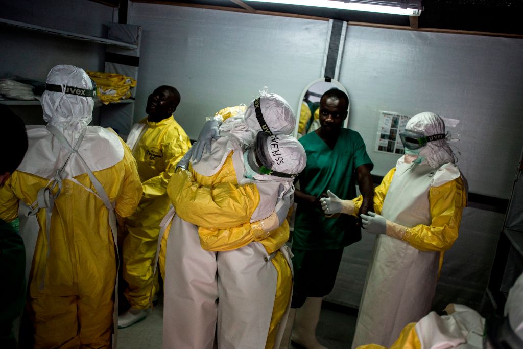 doctors embrace before heading into ebola treatment center