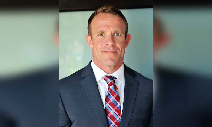 Navy SEAL Edward Gallagher is facing charges of premediated murder and other offenses in connection with the fatal stabbing of a teenage ISIS prisoner under his care in Iraq in 2017 and the shooting of unarmed Iraqi civilians. In San Diego, on 2018. (Andrea Gallagher via AP)