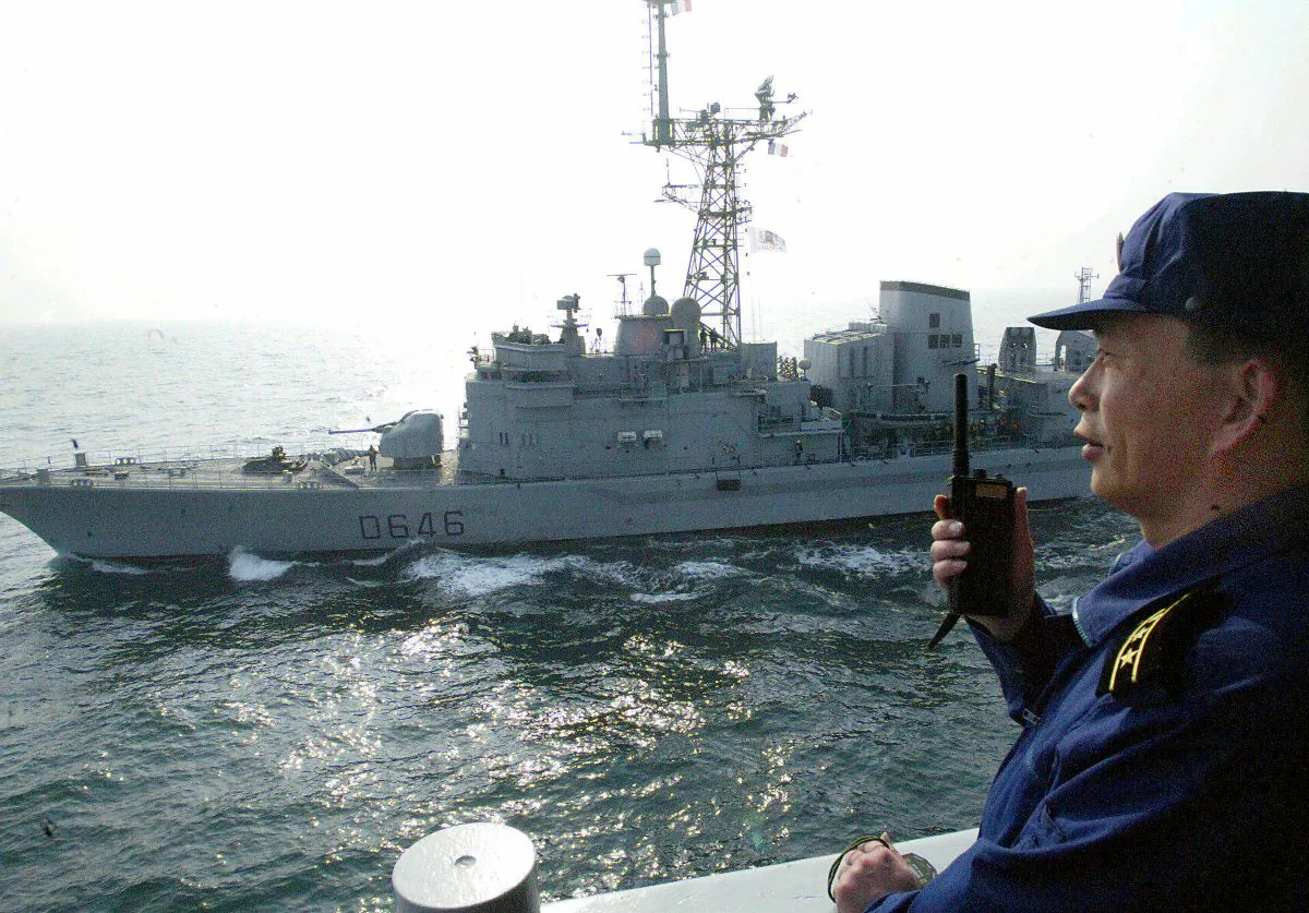 A Chinese naval officer communicates with his French counterparts during a joint exercise 16 March 2004, in the East China Sea STR/AFP/Getty Images