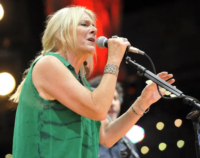 Pegi Young & The Survivors perform with Neil Young during the Farm Aid 2013 concert at Saratoga Performing Arts Center in Saratoga Springs, N.Y. On Sept. 21, 2013. (AP Photo/Hans Pennink)