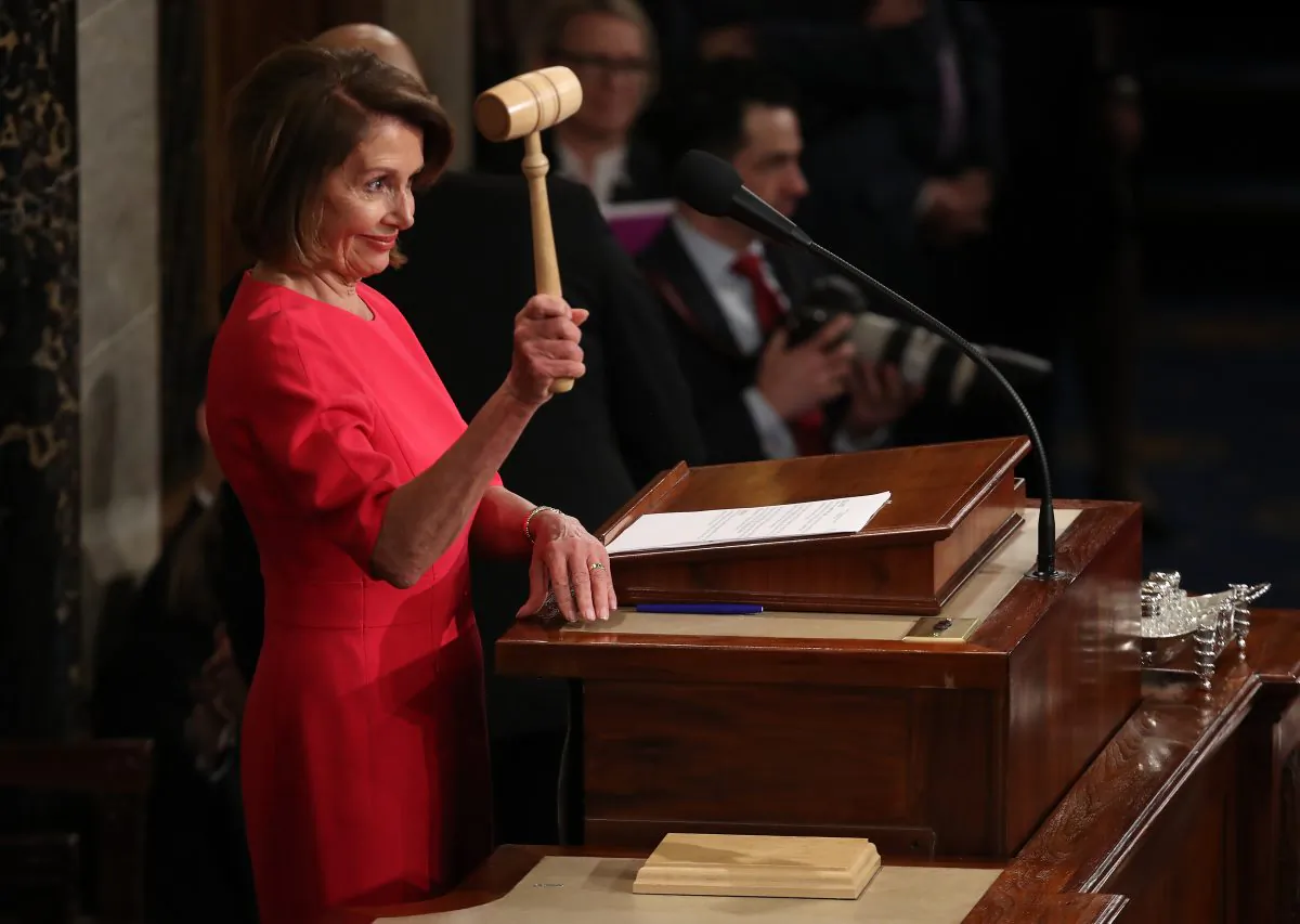 Speaker of the House Nancy Pelosi (D-Calif.) smiles after receiving the gavel from Rep. Kevin McCarthy (R-Calif.) following her election as the next Speaker of the House during the first session of the 116th Congress at the U.S. Capitol in Washington on Jan. 3, 2019. (Win McNamee/Getty Images)