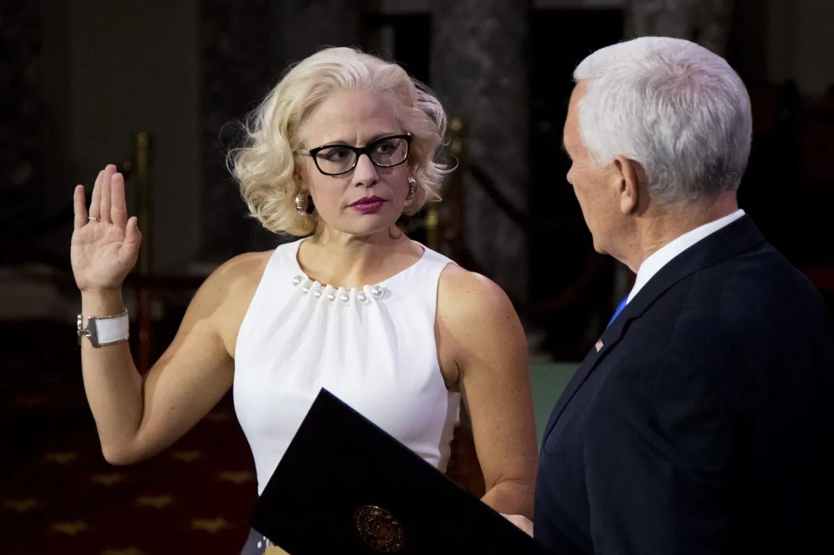Vice President Mike Pence administers a ceremonial Senate oath during a mock swearing-in ceremony to Sen. Kyrsten Sinema (D-Ariz.) in the Old Senate Chamber on Capitol Hill in Washington on Jan. 3, 2019. (Manuel Balce Ceneta/AP Photo)